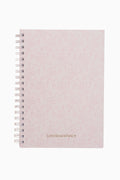 Pink textured notebook with 'LOVE SHACK FANCY' branding on a white background
