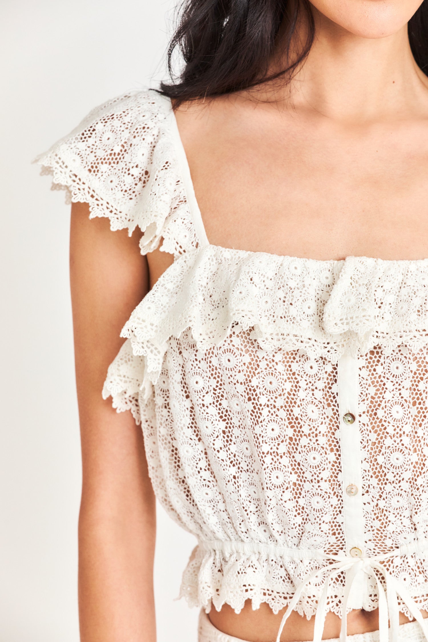 Close up image detailing lace on Mia Lace Top in True White