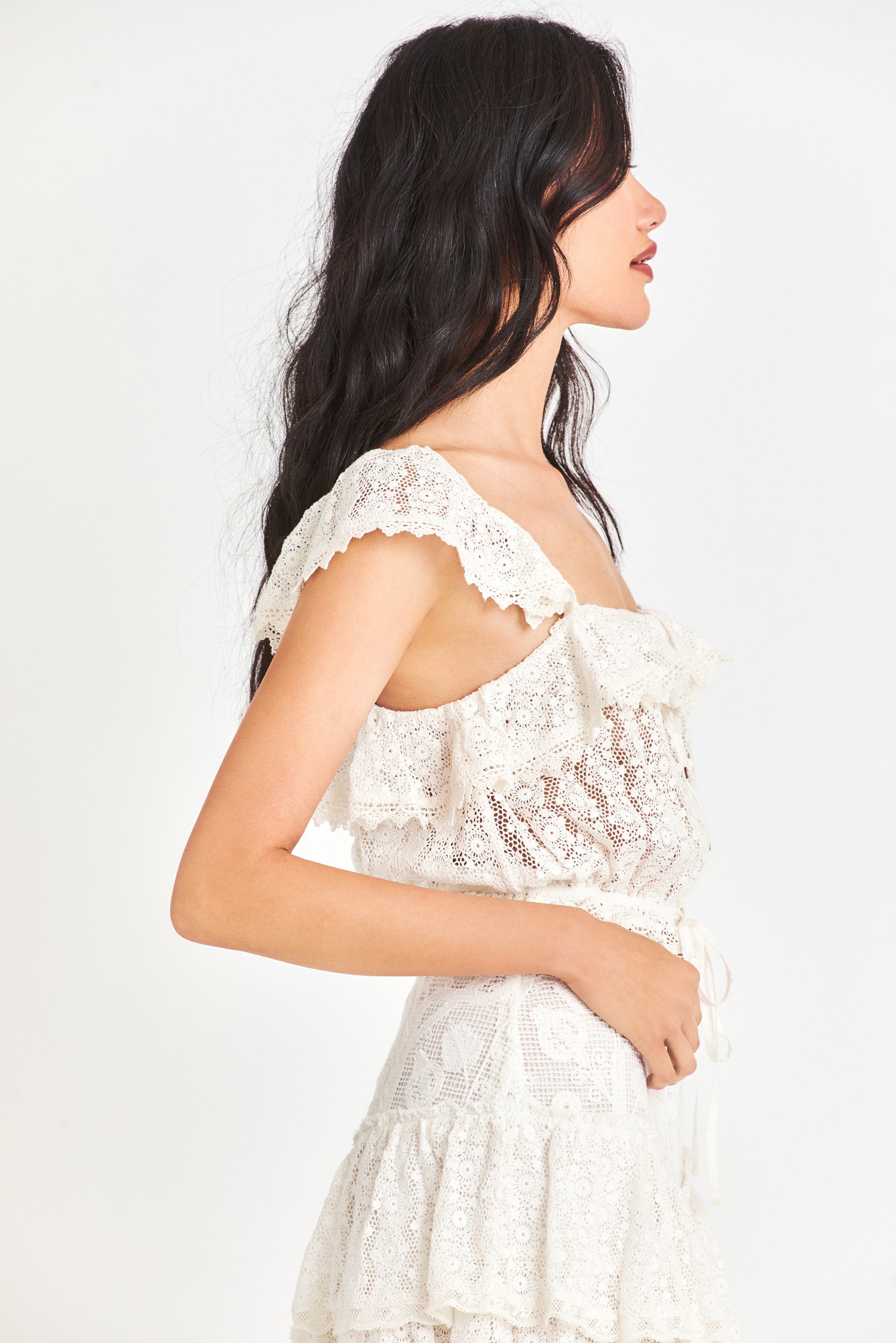 Side image of model wearing Mia Lace Top in True White