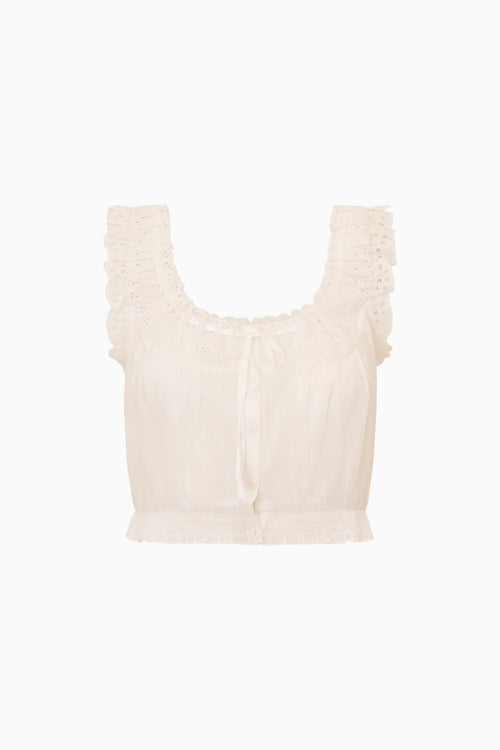Beige sleeveless top with ruffled details on a white background