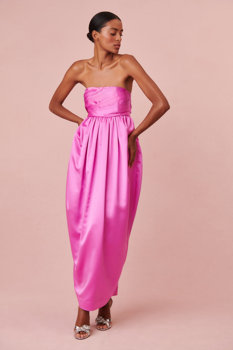 Vibrant pink dress with luxe satin fabric in a tulip silhouette