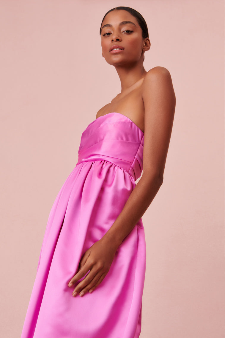 Vibrant pink dress with luxe satin fabric in a tulip silhouette