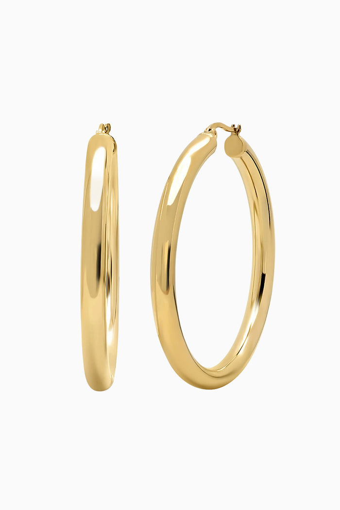 gold hoop earrings on white background