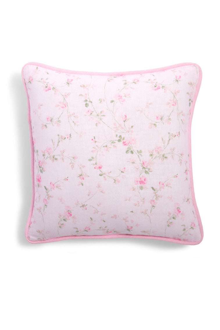 Throw pillow with a pink floral print.
