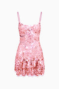 Pink sequin dress on a white background