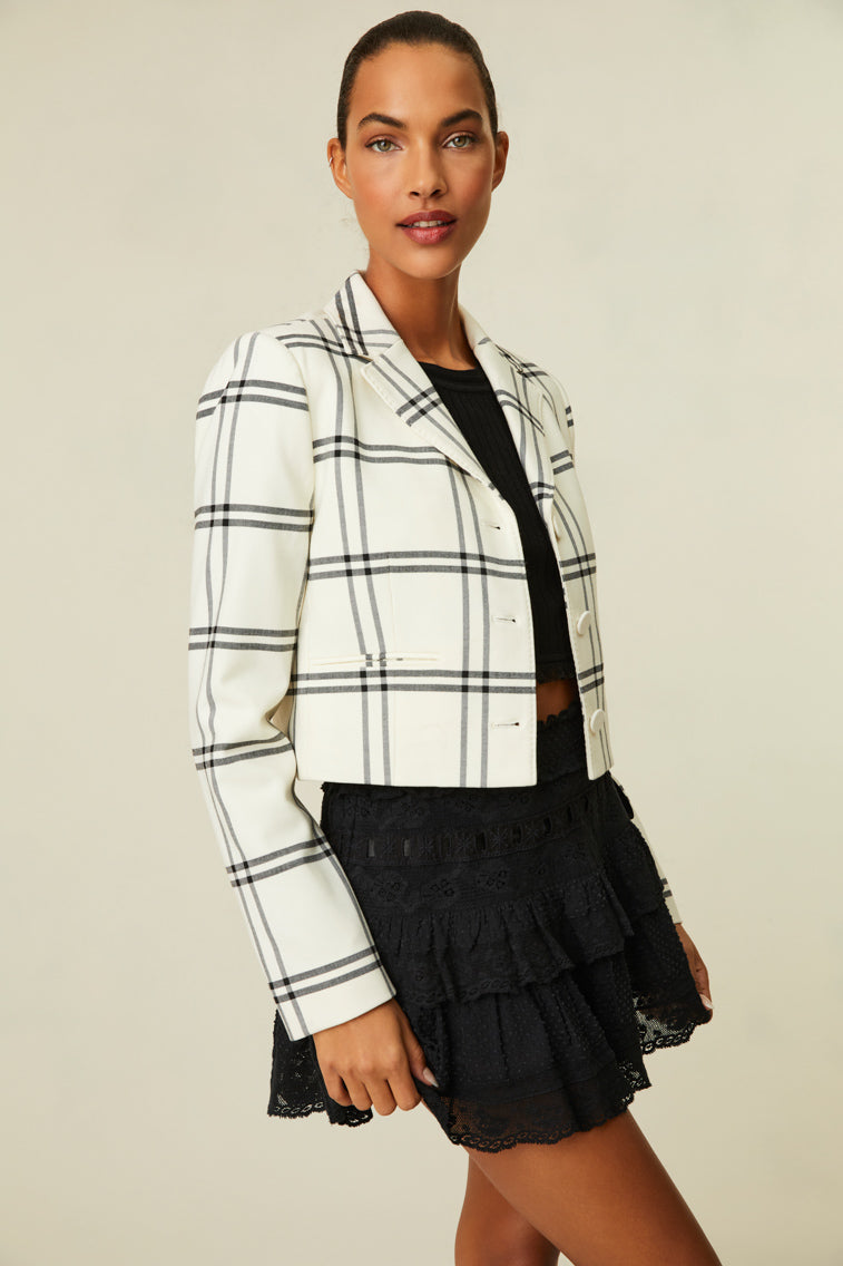 Fitted jacket featuring a chic black and white plaid.