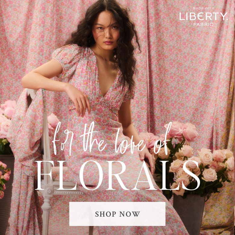 Model wearing a LoveShackFancy dress made with Liberty Fabrics. Shop the Liberty Capsule Collection.