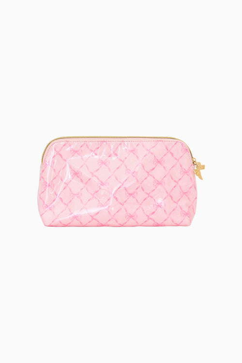 Pink bow print cosmetic bag on a white background