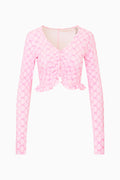 Pink bow print jacket on a white background