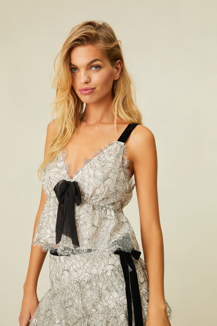 Tank features delicate French lace, velvet tape straps, and frayed bow detail at center front.