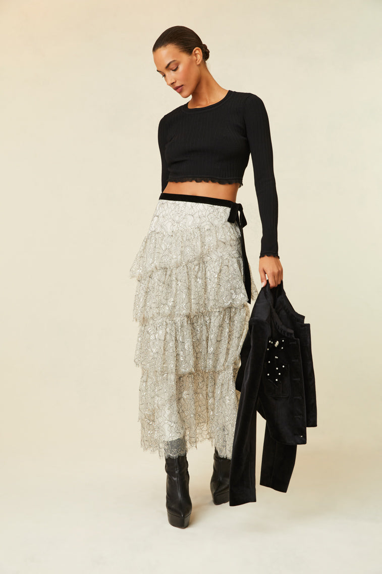 Midi skirt features multi-tiered layers of delicate French lace and a velvet tape ribbon.