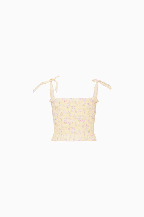 Yellow floral top on a white background