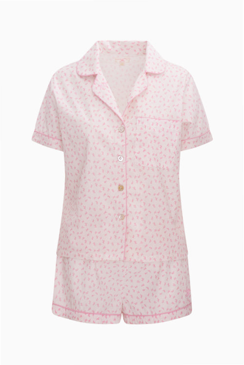 Pink patterned pajama set on a white background