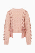 Tween pink textured knit pullover with ribbon threaded through and bow at hem
