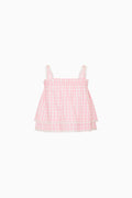 Pink gingham top on a white background