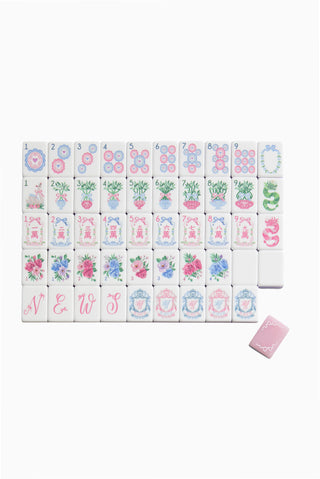 Pastel floral mahjong tile set with numbered tiles and decorative backs