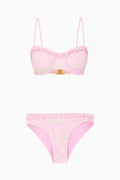 Pink bikini set with floral pattern on a white background