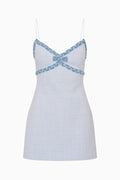 Blue tweed mini dress with blue lace details on a white background