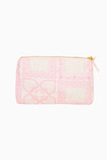 Pink quilted pouch with heart pattern on a white background