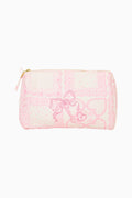 Small pouch with pink heart pattern on a white background