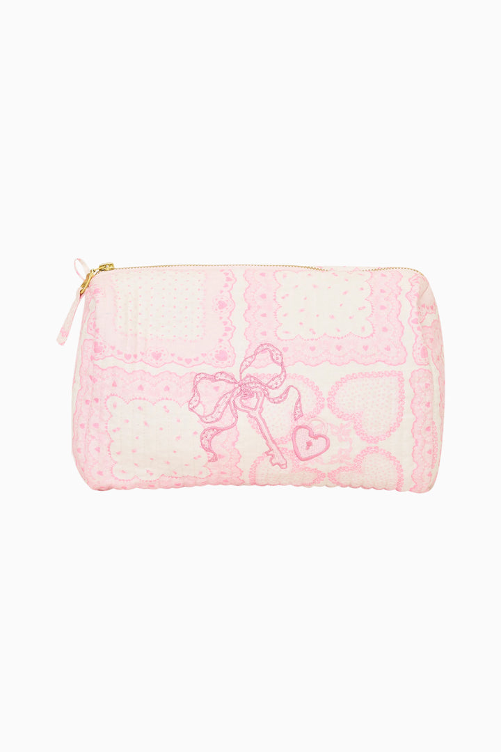 Small pouch with pink heart pattern on a white background