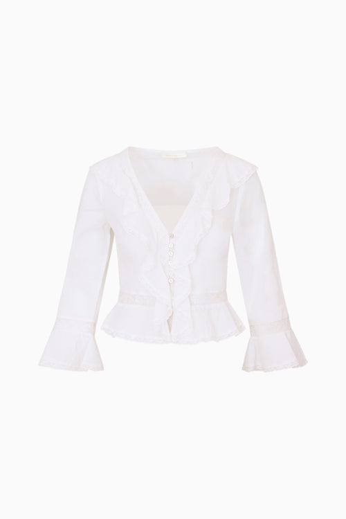 White ruffle top on a white background