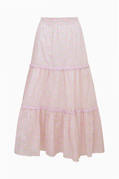 Long, light pink skirt with lace details on a white background