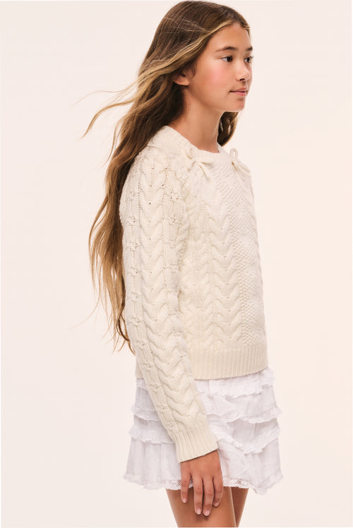 Girls off-white cable-knit sweater with long sleeves and textured knit cables