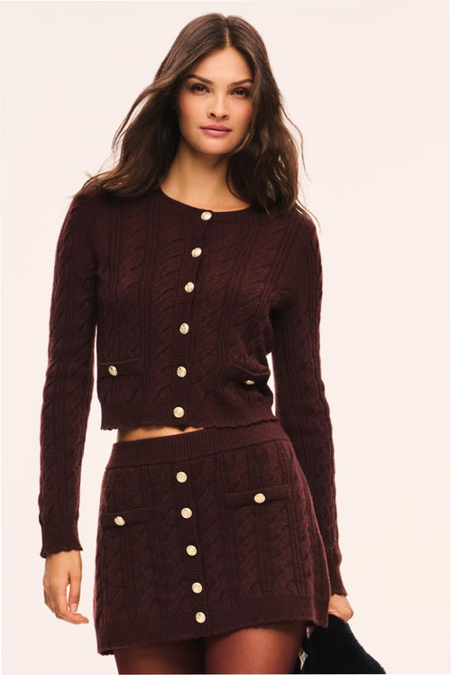 Burgundy cable-knit cardigan with button front and long sleeves