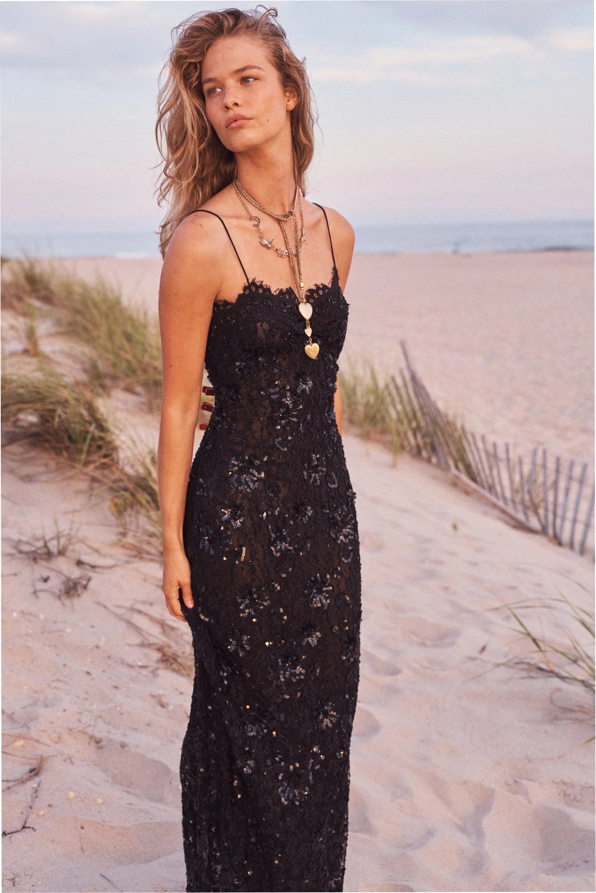 Women sitting in grass field wearing LoveShackFancy Slip Dresses