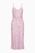 Pink floral slip dress on a white background