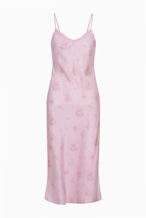 Pink floral slip dress on a white background