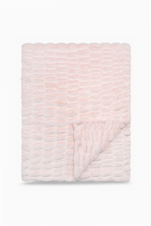 Folded throw blanket in petal pink textured with a soft, frosted finish