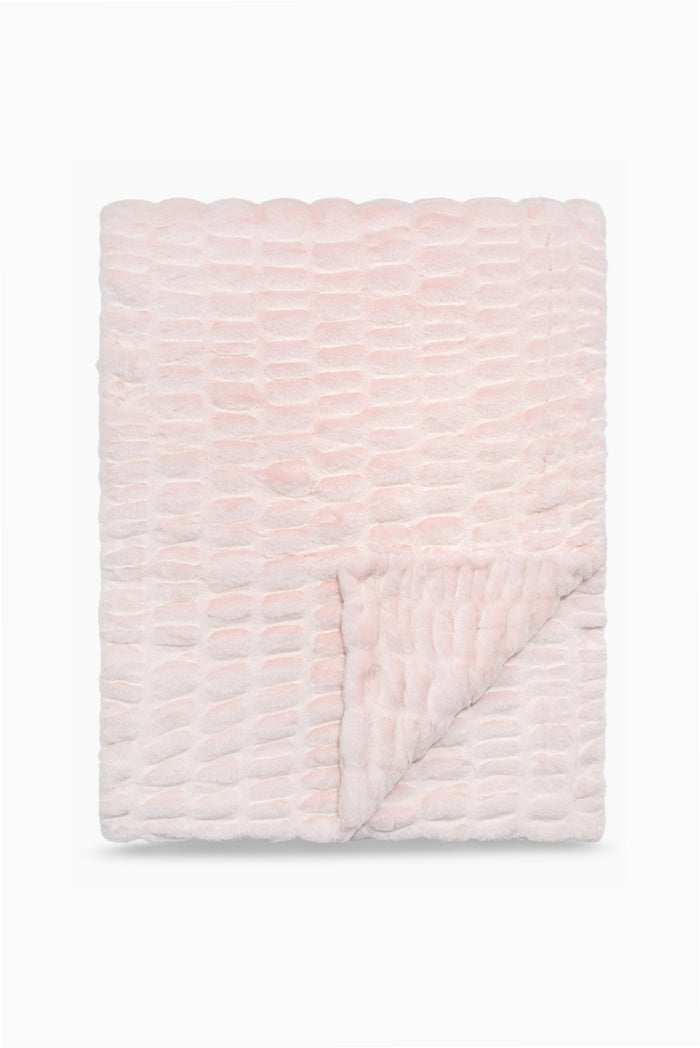 Folded throw blanket in petal pink textured with a soft, frosted finish