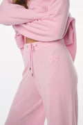 Pink tracksuit with drawstring waistband on a white background