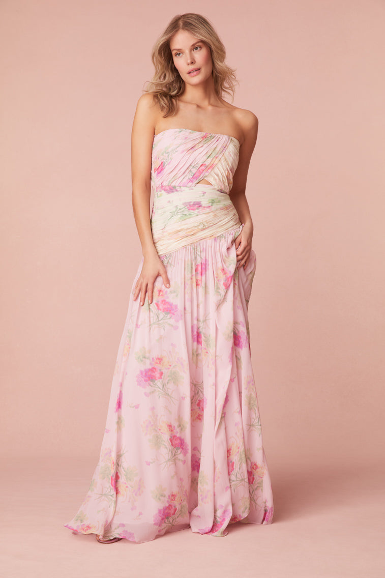Floral gown featuring color-blocking pastels and a strapless neckline. The dress includes a structured bodice for support, lightweight ruching, and gripping tape at the opening edge of the neckline. A keyhole detail sits at center front.