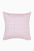 Pink floral quilted pillow on a white background