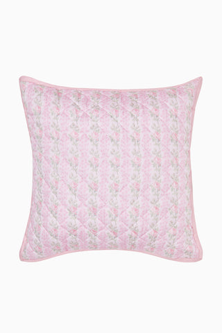 Pink floral quilted pillow on a white background