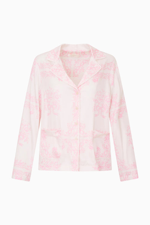 Pink patterened shirt on a white background