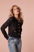 Jacket with floral lace with texture for elevated detail. The jacket features sheering, custom gold military buttons, and chic satin trim details.