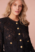 Jacket with floral lace with texture for elevated detail. The jacket features sheering, custom gold military buttons, and chic satin trim details.