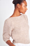 The Rosie pullover is made from baby alpaca while being extremely light and full with a chunky look. It has a straight rib neckline and a straight body with rib finishing. It is an open knit weave with a puffy shoulder that slims out at the bottom. 