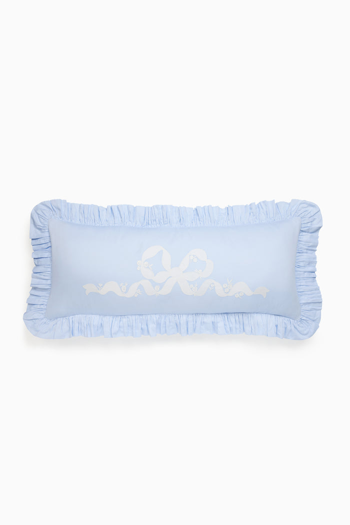 Light blue decorative pillow with ruffled edges and embroidered text on a white background