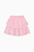 Pink tiered skirt with white pattern on a white background