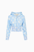 Light blue hoodie with bow pattern on a white background