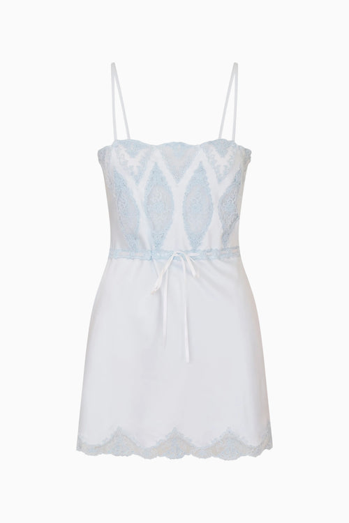 Blue slip dress on a white background
