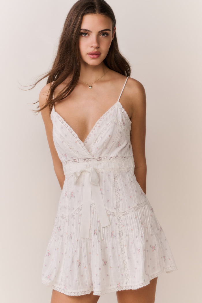 Cream floral embroidered mini dress with V-neck, spaghetti straps, flowy tiered skirt
