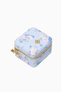 Floral-patterned jewelry box with gold accents on a white background