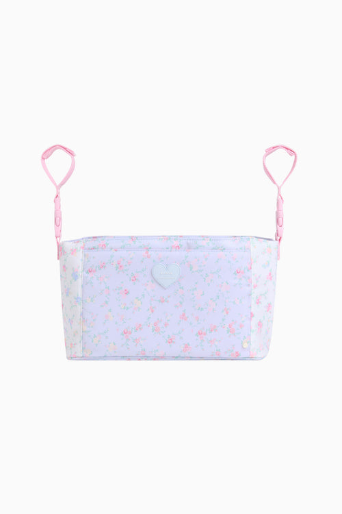 Light blue top with pink floral pattern and thin straps on a white background