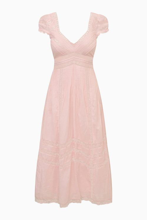 Pink dress with ruffled straps on a white background